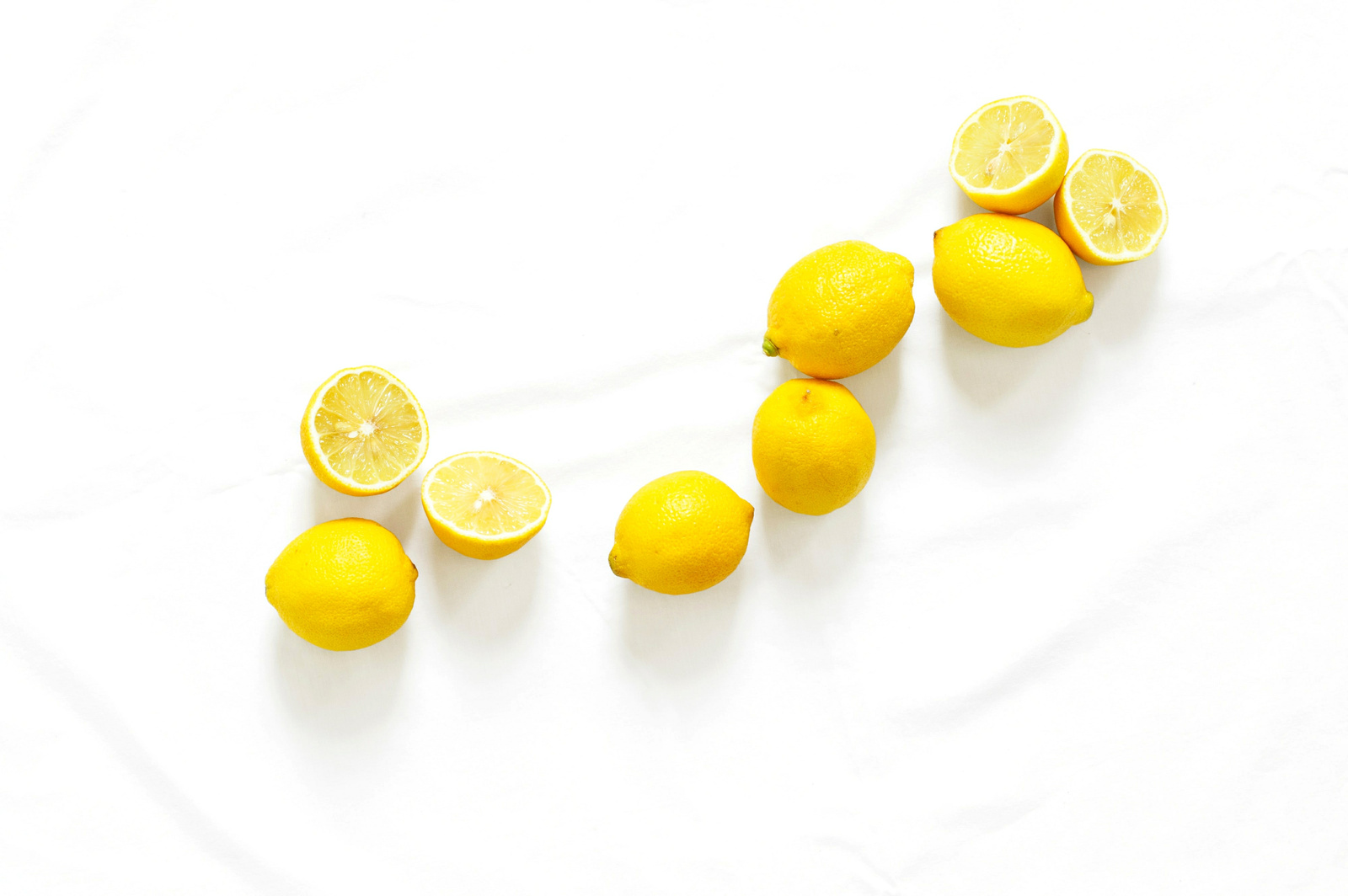 Lemons on White Marble Background